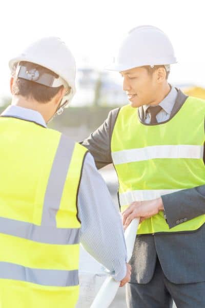 Engineers reviewing site plans alta survey compliance - ALTA SURVEY Pennsylvania Engineers reviewing site plans to align ALTA survey data with city slope and construction codes under new insurance guidelines