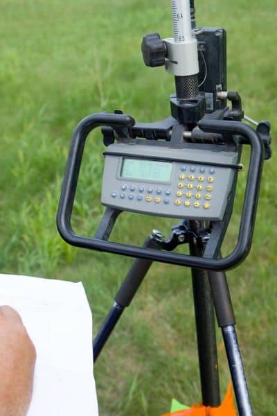 Land surveyor equipment measuring boundary - ALTA SURVEY Pennsylvania Close-up of land surveyor equipment used during a property line survey to measure and confirm boundary lines