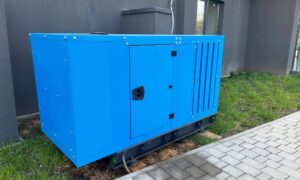 Generator positioned beside a building where a construction survey supports accurate equipment placement and site layout